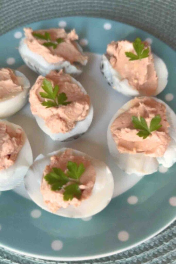 Deviled Eggs garnished with a small parsley leaf