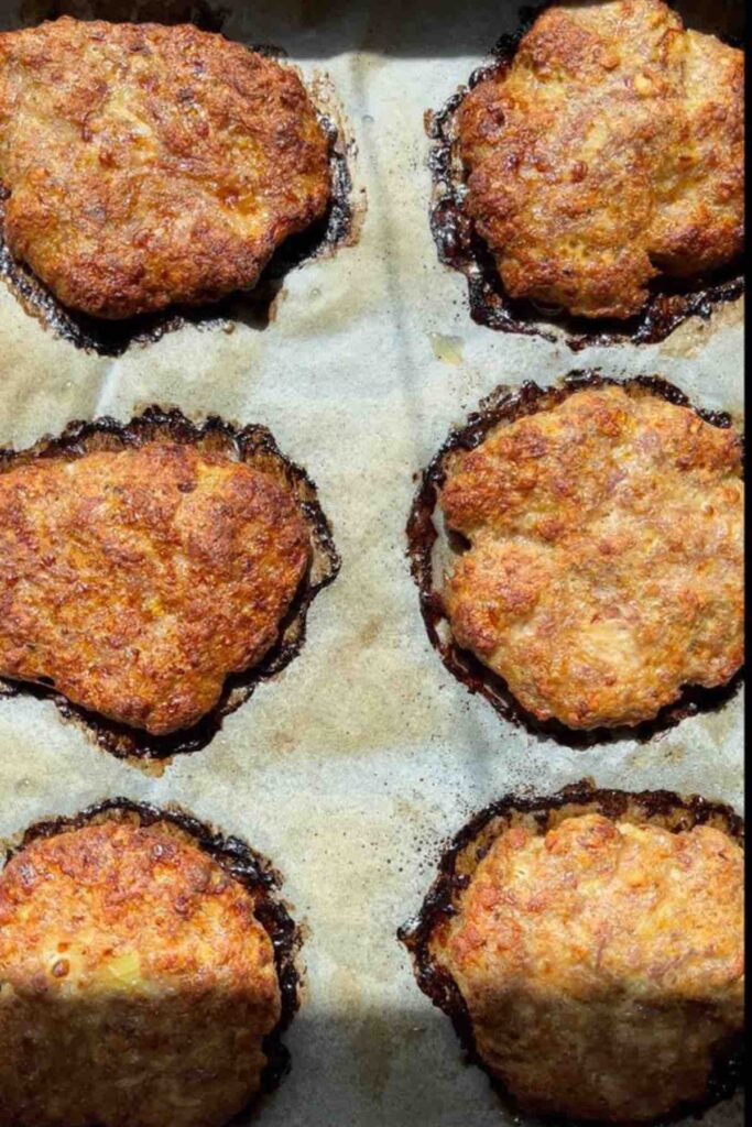 homemade baked burgers in a tray