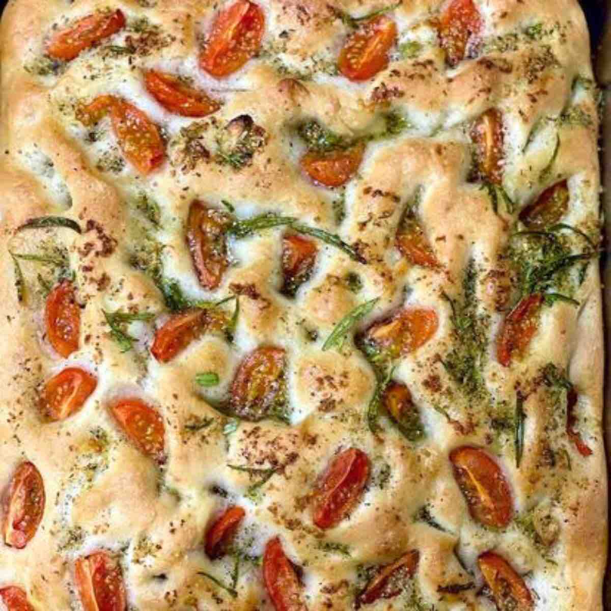talian Focaccia Bread Recipe with cherry tomatoes, rosemary, and extra virgin olive oil, seasoned with Himalayan salt