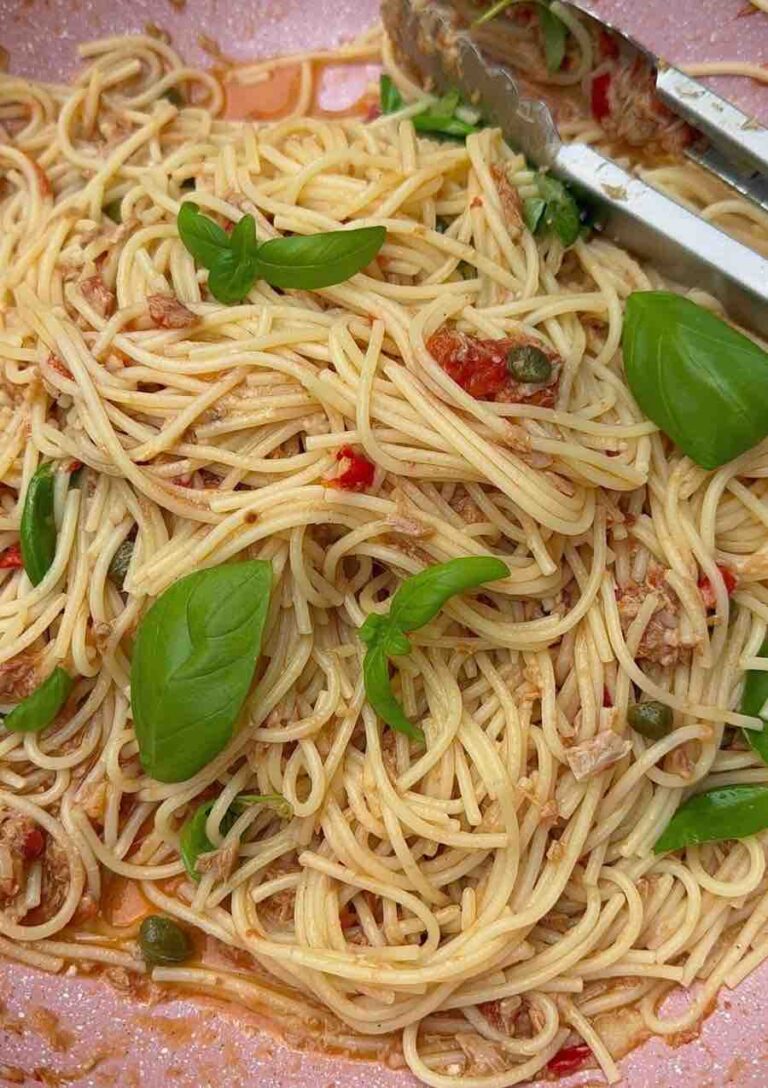 Tuna, caper & chilli spaghetti in a pan ready to be served