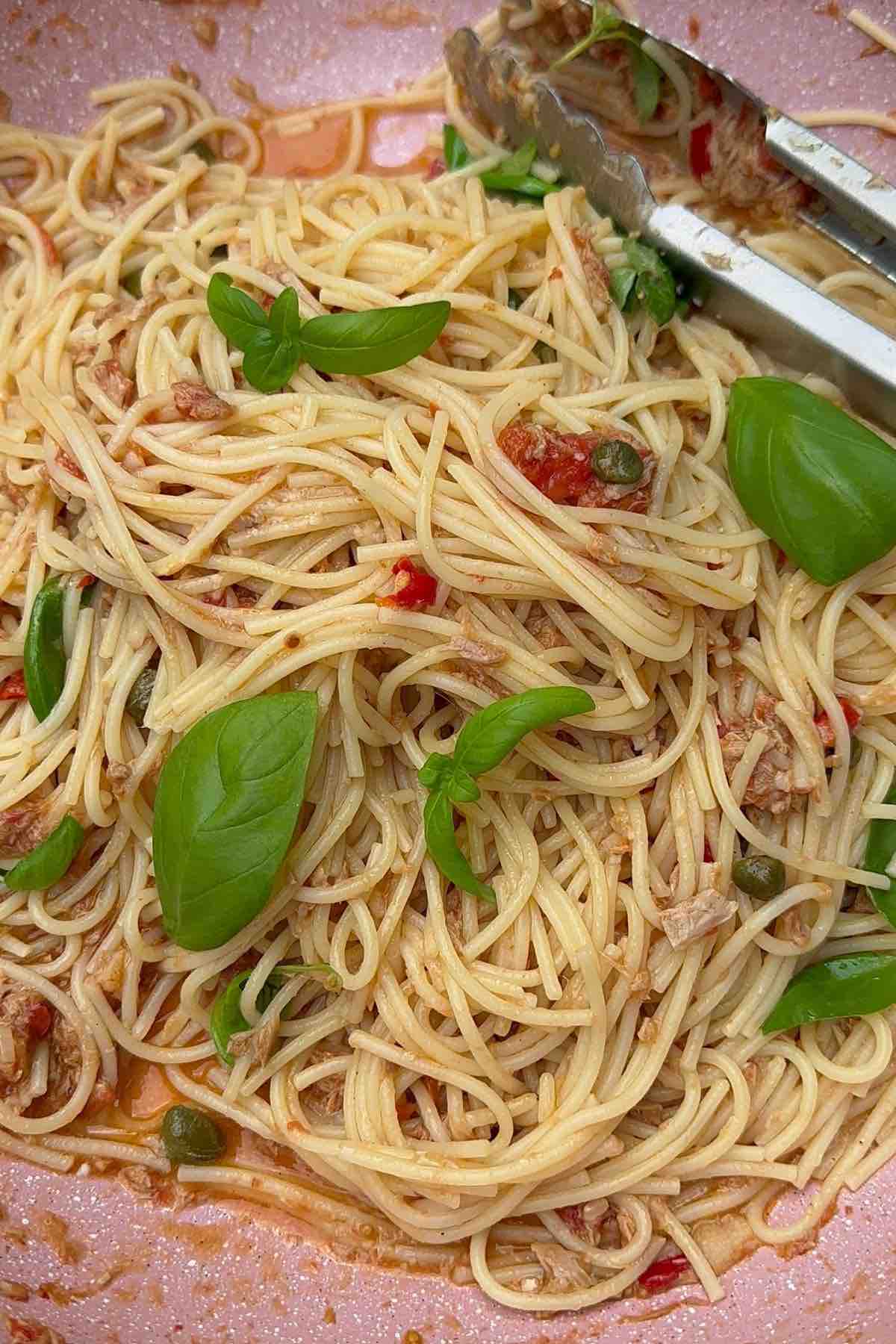 Tuna, caper & chilli spaghetti  in a pan ready to be served