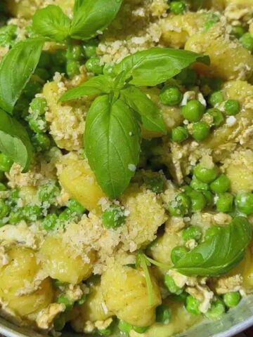 A pan of Pesto Gnocchi with Peas and Basil.