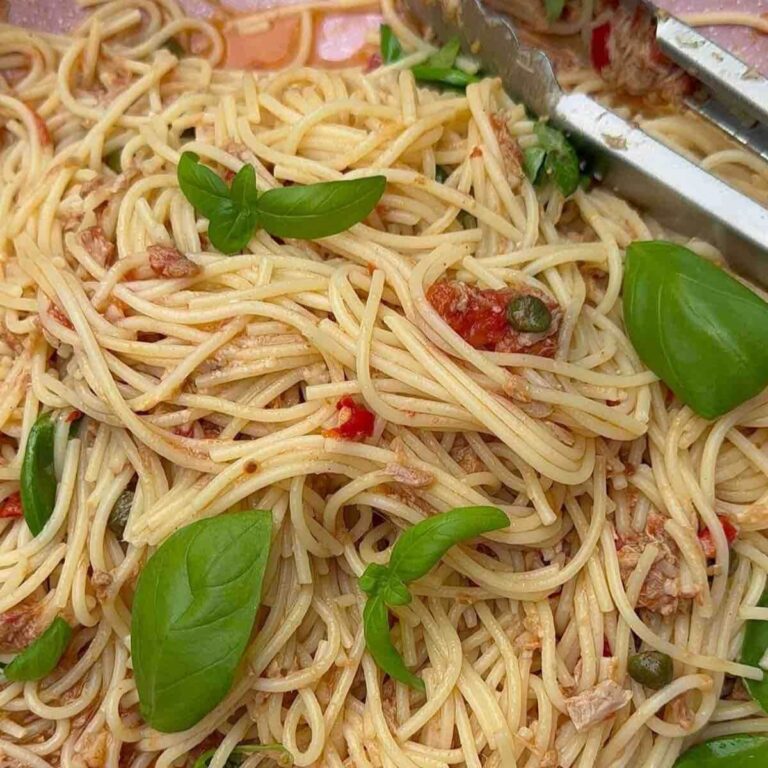 Tuna, caper & chilli spaghetti in a pan ready to be served.