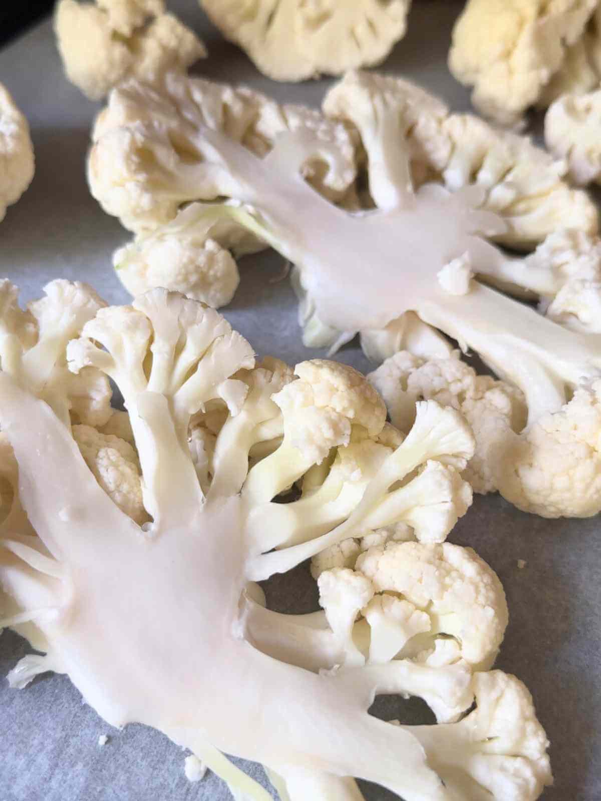 A head of white cauliflower cut into steaks 