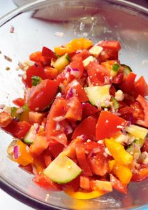 Fresh and colorful Feta, cucumber, and Tomato Salad in a bowl.