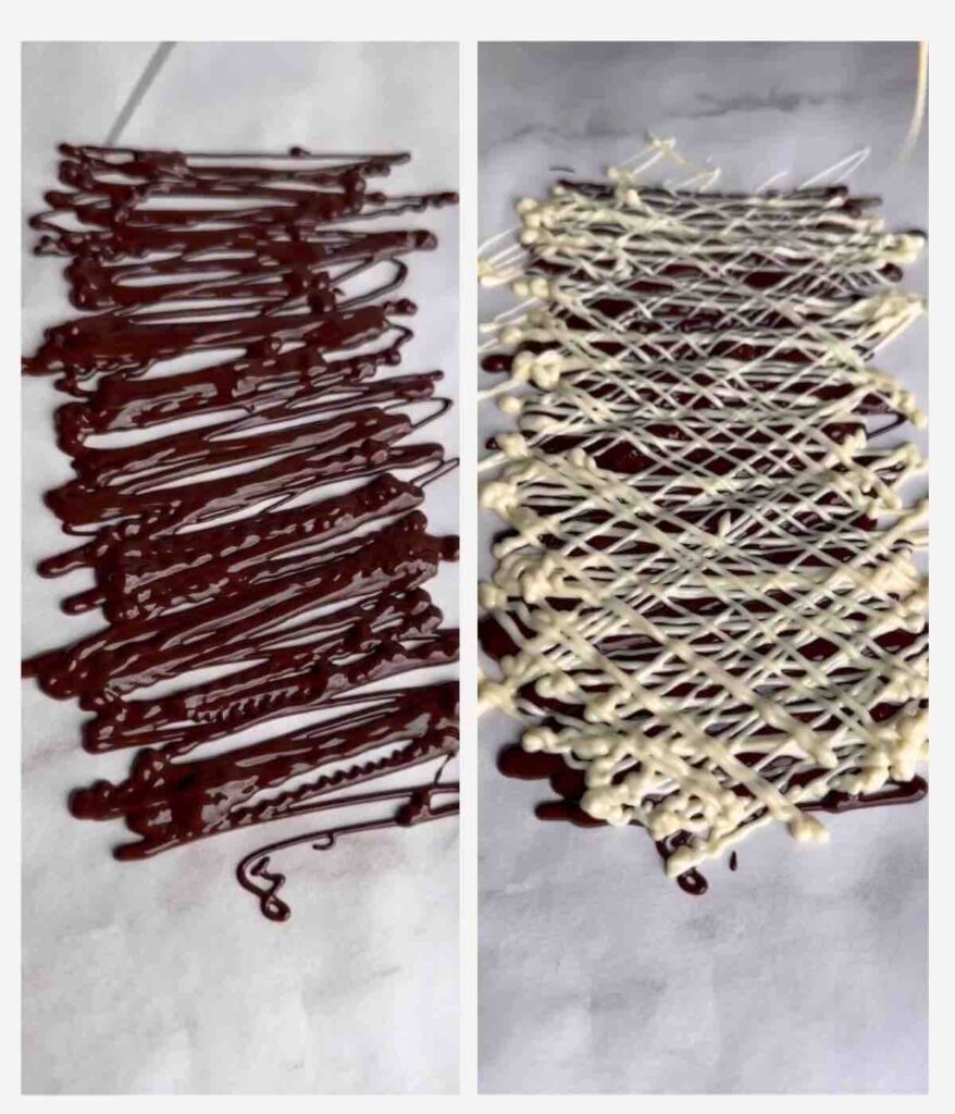 Dark chocolate lines on a baking sheet, followed by white chocolate lines.