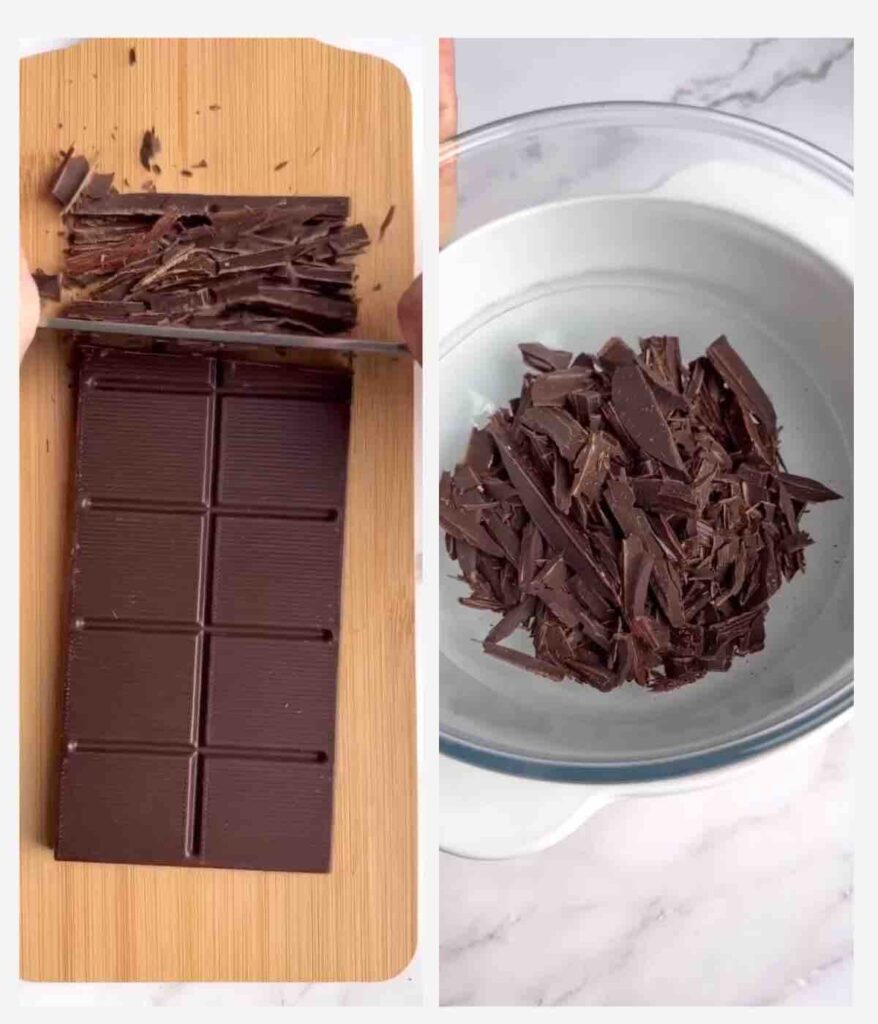 Dark chocolate being chopped on a wooden board and placed in a glass bowl.