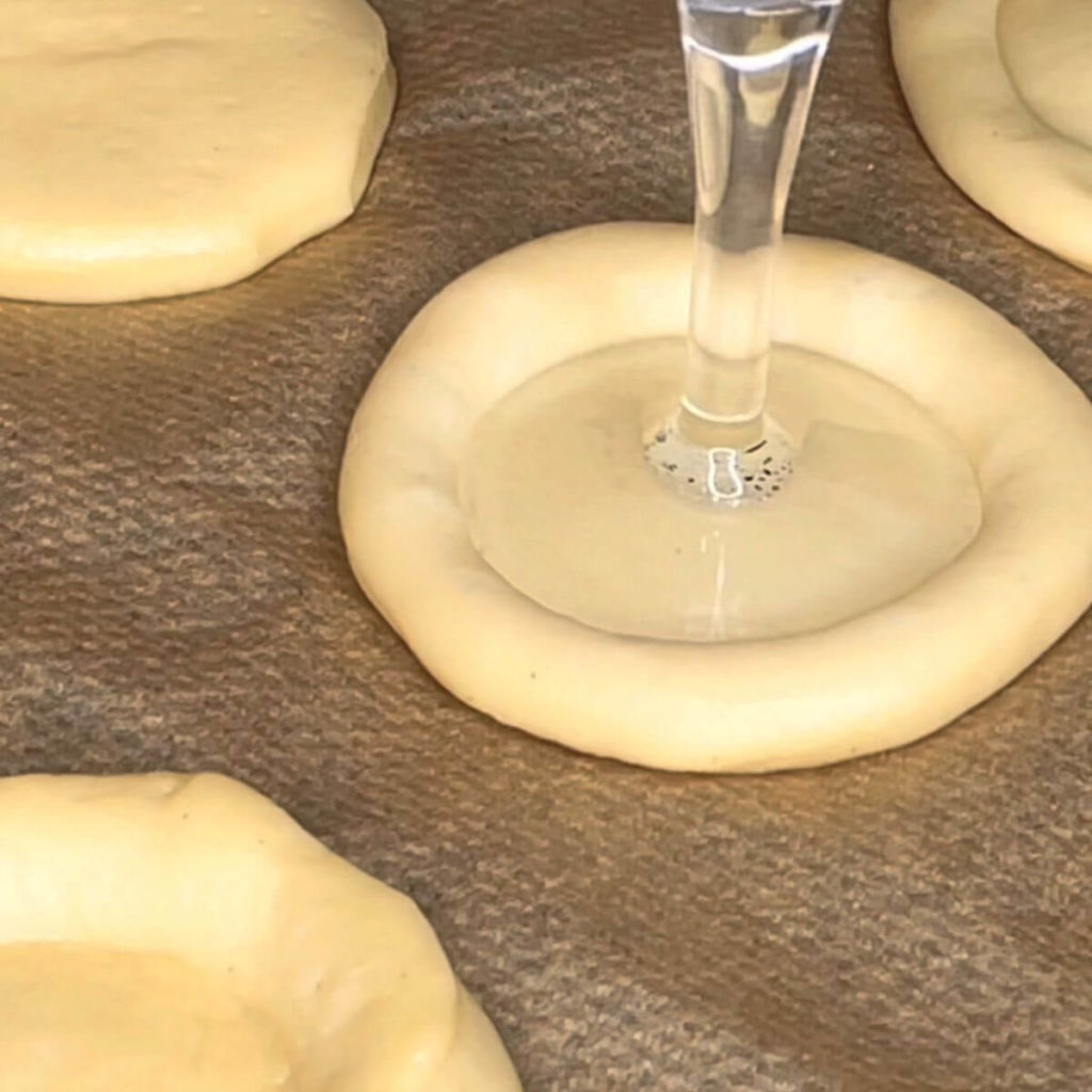 Dough circles indented with the base of a cognac glass. 