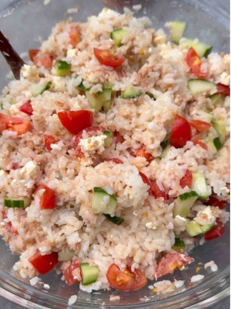 Quick mixed rice dish with fish, veggies, and cheese cubes