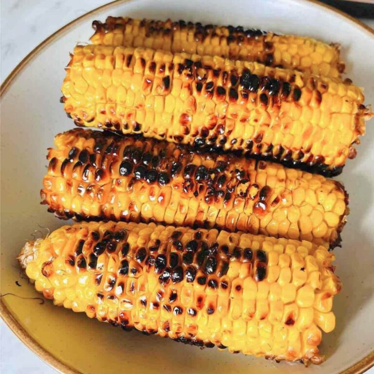 Grilled Corn on a shallow plate