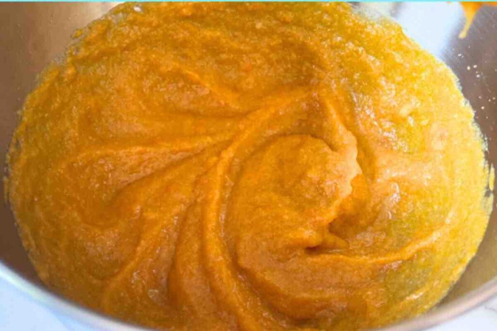 Pumpkin puree, oil, brown sugar, granulated sugar, eggs, and vanilla extract mixed in a bowl until smooth and well combined.