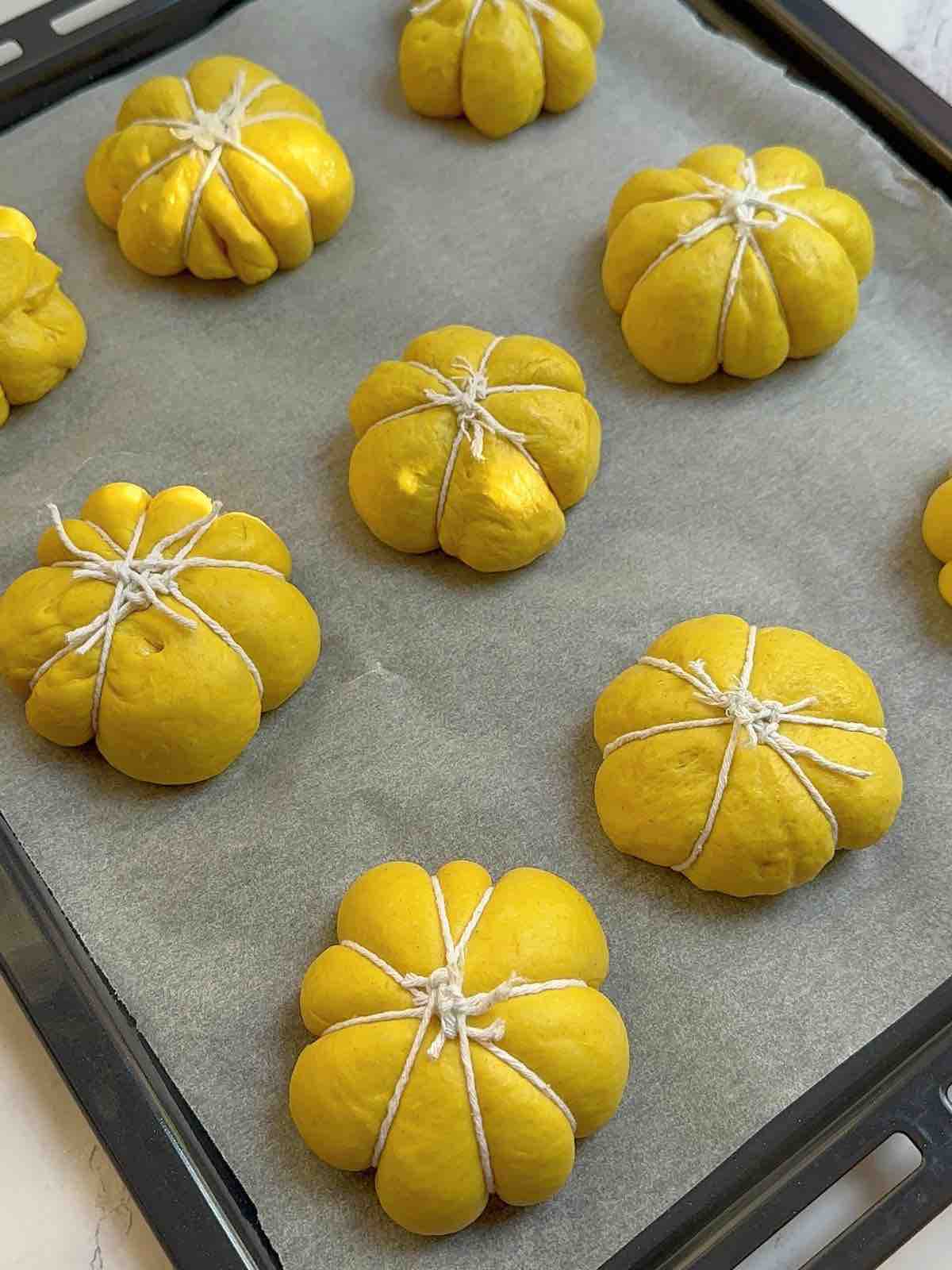 pumpkin-shaped halloween bread before baking