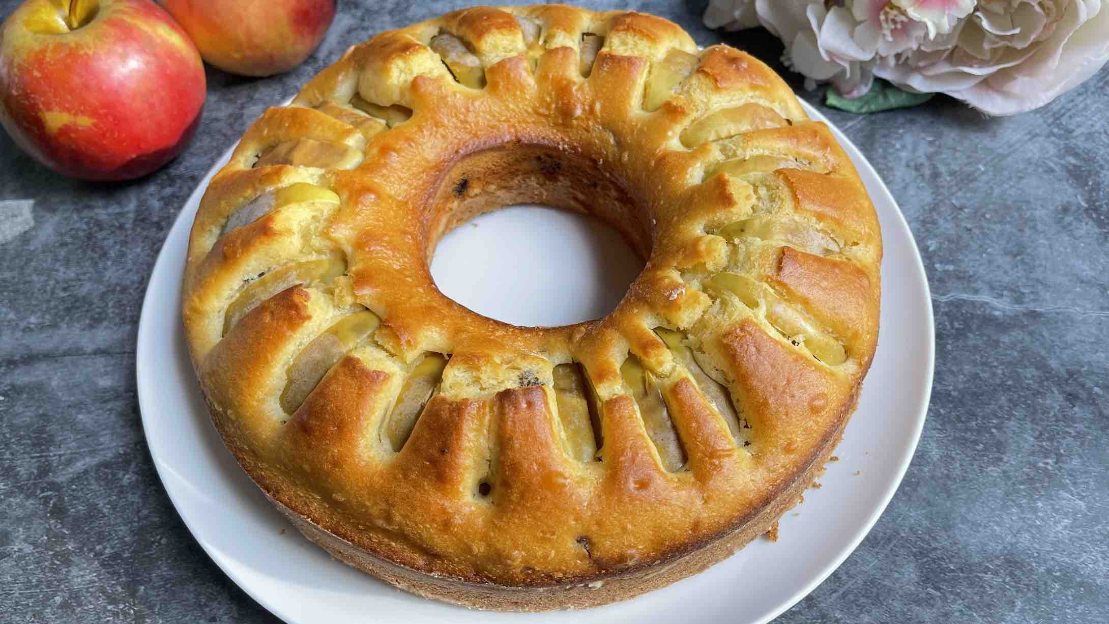 Apple and Raisin Bundt Cake on a round white plate 