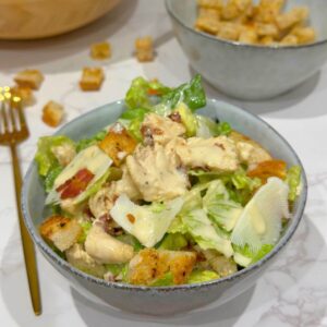 Chicken and Bacon Caesar Salad in a grey bowl.