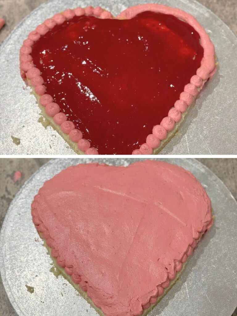 First layer of cake topped with berry puree and evenly spread buttercream.