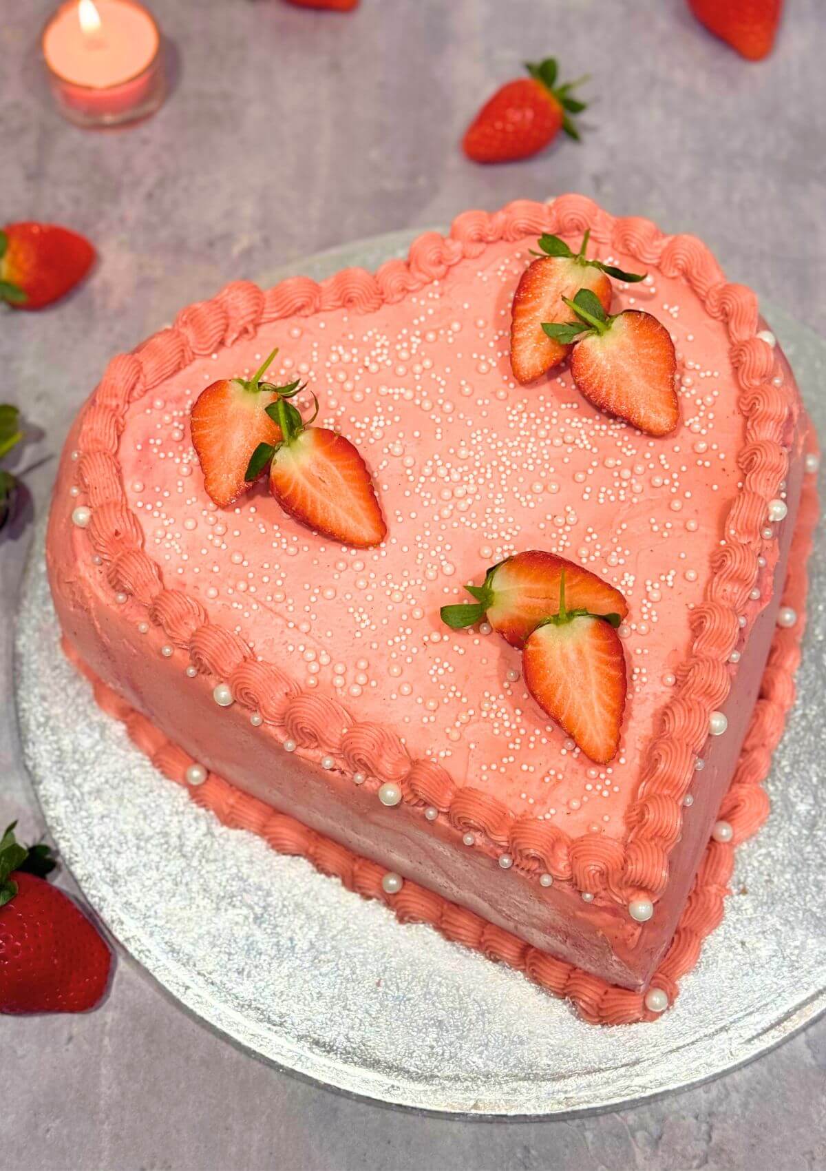 Raspberry Heart Shaped Cake, decorated with fresh strawberries and sugar pearls