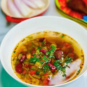 A bowl of Traditional Romanian Bean Soup (Ciorba De Fasole).