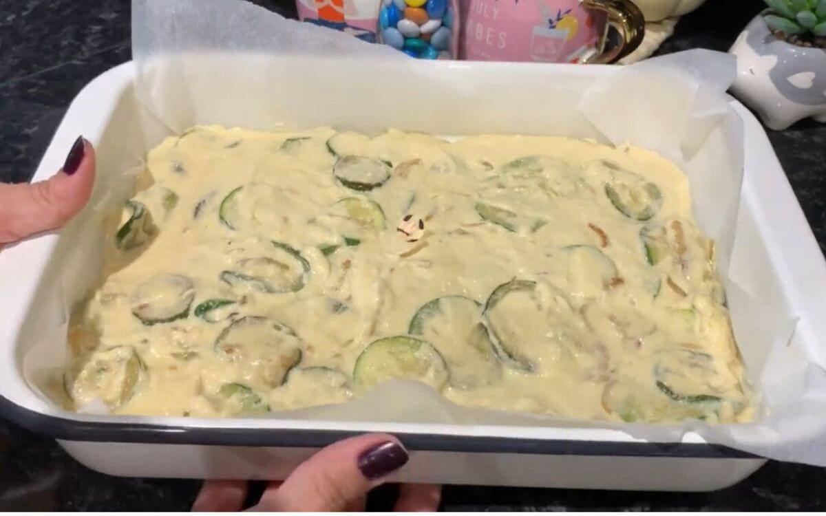 Unbaked zucchini scarpaccia ready to go into the oven.