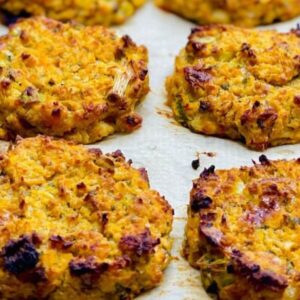 Beans and quinoa baked fritters arranged on a baking tray, ready to serve.