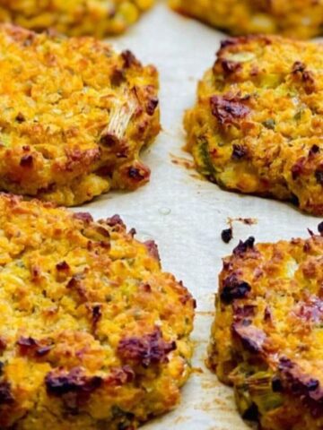 Beans and quinoa baked fritters arranged on a baking tray, ready to serve.